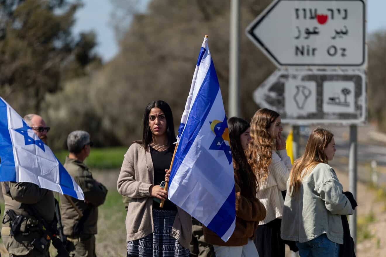 People pay their respects during the funeral procession of late Israeli hostage Oded Lifshitz at the entrance to Kibbutz Nir Oz, Feb. 25, 2025. Photo by Yonatan Sindel/Flash90.