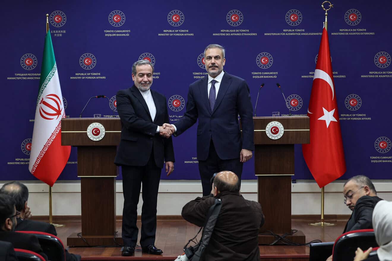 Turkish Foreign Minister Hakan Fidan (R) shakes hands with Iranian Foreign Minister Abbas Araghchi (L) at the end of a joint press conference after their meeting in Ankara on Dec. 2, 2024. Photo by Adem Altan/AFP via Getty Images.