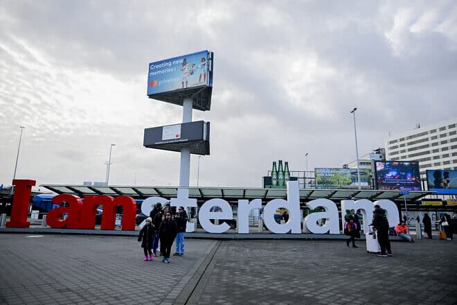 Tourists gather outside Amsterdam Airport Schiphol, Dec. 23, 2024. Photo by Mouneb Taim/Middle East Images/AFP via Getty Images.
