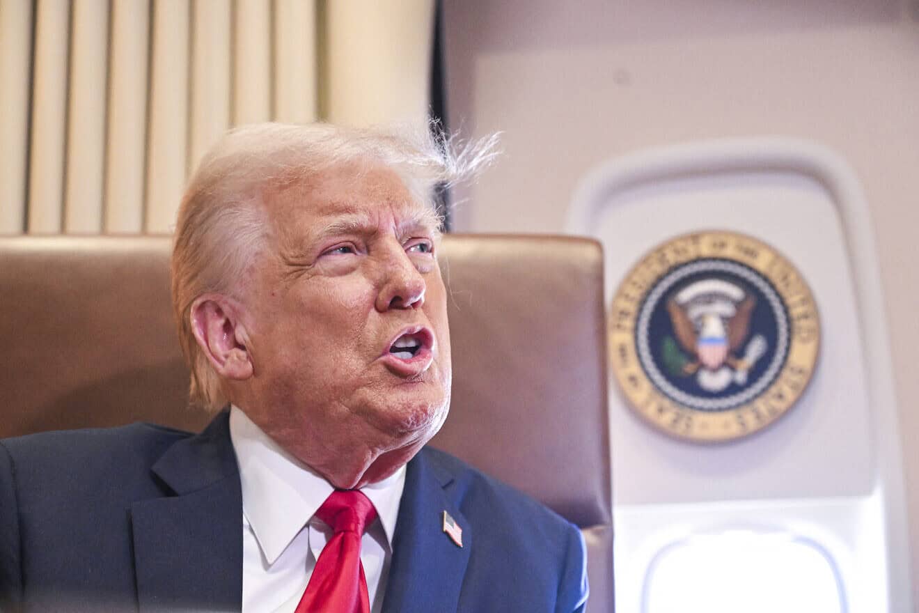 US President Donald Trump speaks to the press before signing a proclamation renaming the Gulf of Mexico as the Gulf of America aboard Air Force One enroute to New Orleans, Louisiana on Feb. 9, 2025. Photo by Roberto Schmidt/AFP via Getty Images.