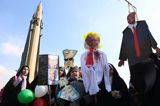 Iranians carry an effigy of US President Donald Trump during gathering to mark the 46th anniversary of the Islamic Revolution in front of the Azadi Tower in Tehran on Feb. 10, 2025. Photo by -/AFP via Getty Images.
