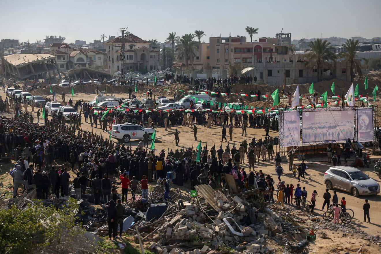 Red Cross vehicles wait at the spot where Hamas terrorists are expected to hand over Israeli hostages in Khan Yunis in the southern Gaza Strip,  Feb. 15, 2025. Photo by Bashar Taleb/AFP via Getty Images.