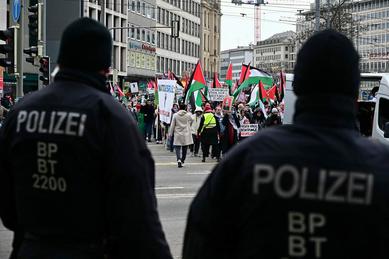 Police officers look on as protesters march during an anti-Israel protest in Munich, Feb. 15, 2025. Photo by Tobias Schwarz/AFP via Getty Images.