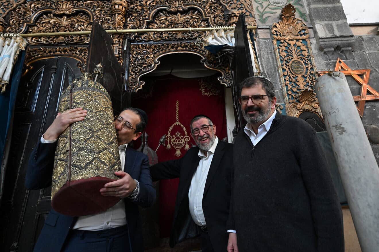 Syrian U.S.-based rabbi Joseph Hamra (center) visits the Al-Franj Synagogue in the Jewish quarter in Old Damascus' Bab Sharqi neighborhood with his son Henry (left) and Rabbi Asher Lopatin, the director of Community Relations of Ann Arbor, Michigan's Jewish Federation, during a visit from the United States on Feb. 18, 2025. Photo by Louai Beshara/AFP via Getty Images.