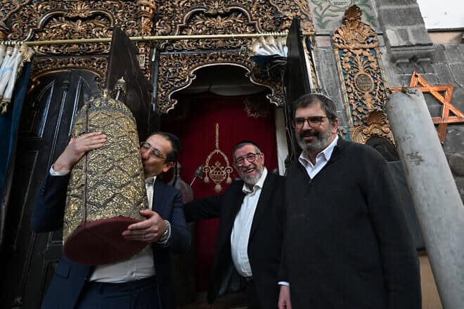 Syrian U.S.-based rabbi Joseph Hamra (center) visits the Al-Franj Synagogue in the Jewish quarter in Old Damascus' Bab Sharqi neighborhood with his son Henry (left) and Rabbi Asher Lopatin, the director of Community Relations of Ann Arbor, Michigan's Jewish Federation, during a visit from the United States on Feb. 18, 2025. Photo by Louai Beshara/AFP via Getty Images.