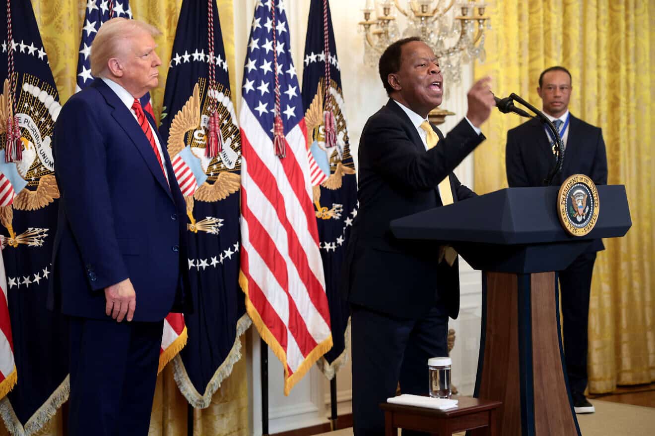 Civil rights attorney Leo Terrell speaks alongside U.S. President Donald Trump and golf legend Tiger Woods during a reception honoring Black History Month in the East Room of the White House, Feb. 20, 2025. Photo by Win McNamee/Getty Images.