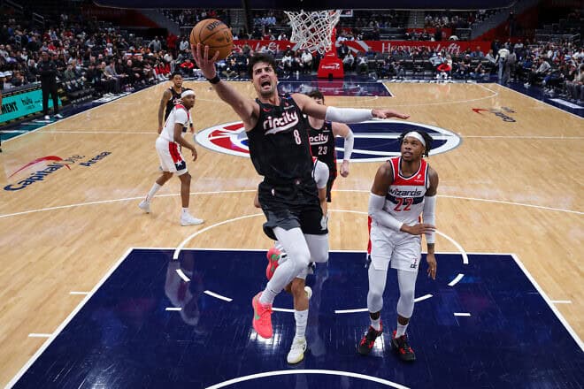Deni Avdija #8 of the Portland Trail Blazers goes to the basket in front of Richaun Holmes #22 of the Washington Wizards during the first half at Capital One Arena in Washington, DC, on Feb. 26, 2025. Photo by Scott Taetsch/Getty Images.