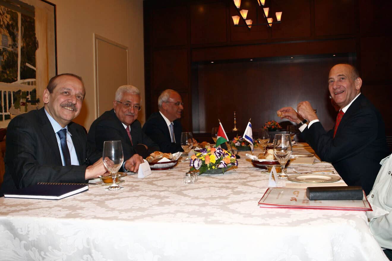 Palestinian Authority chief Mahmoud Abbas (second left) meets with Israeli Prime Minister Ehud Olmert (right) in Jerusalem, Nov. 17, 2008. Photo by Thaer Ganaim/Palestinian Press Office via Getty Images.