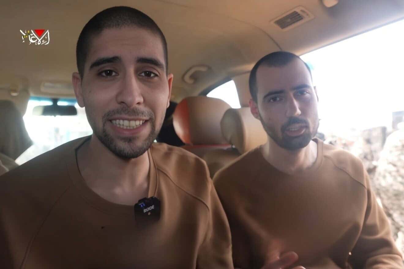 Hostages Guy Gilboa-Dalal and Evyatar David being forced to watch the ceremony of other captives being released in a Hamas propaganda video, the Gaza Strip, Feb. 22, 2025. Source: Israel Hayom.