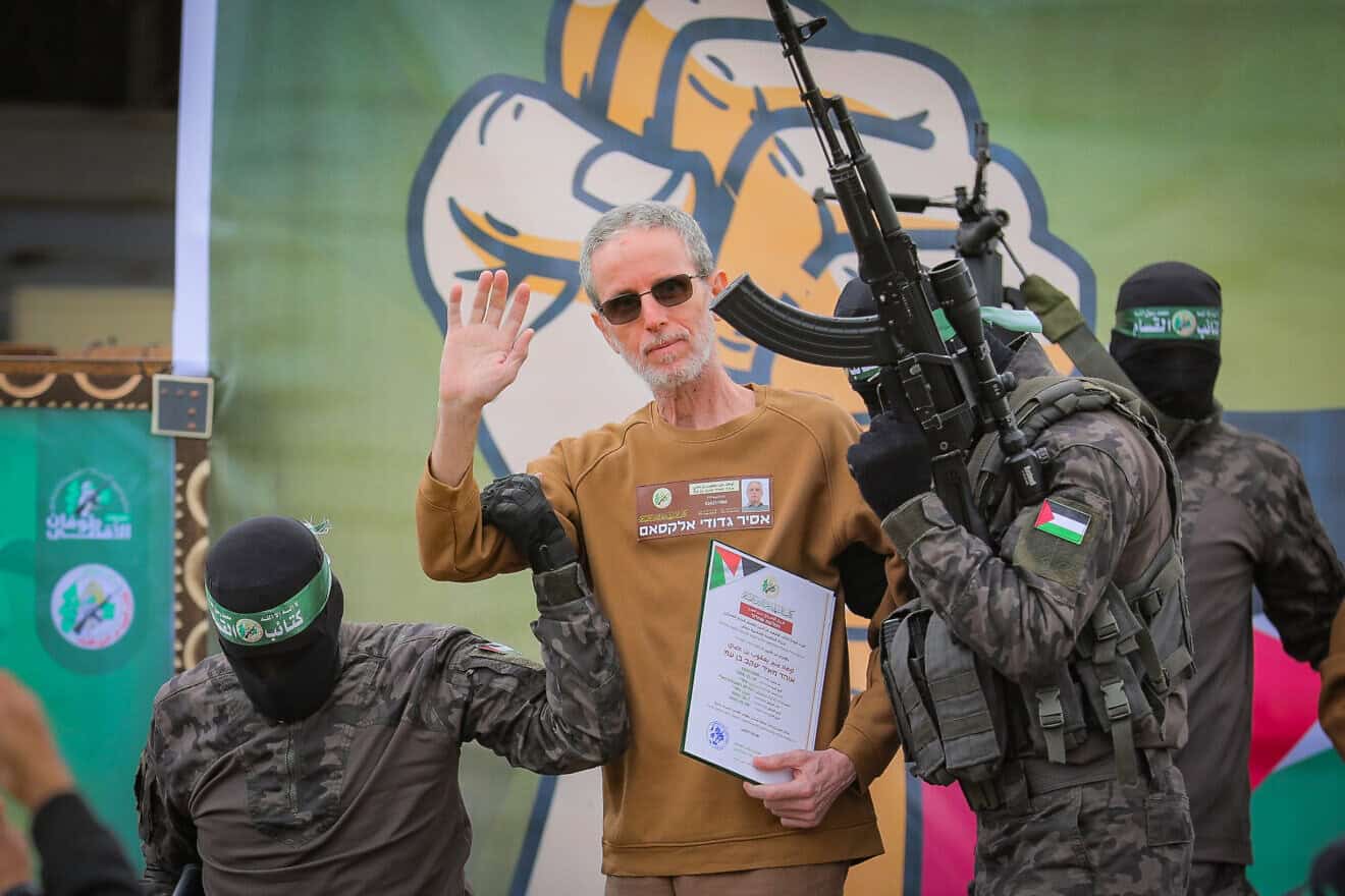 Hamas's Al-Qassam Brigades parade Israeli hostage Ohad Ben Ami, 56, before handing them over to the International Red Cross, Feb 8, 2025. Photo by Photo by Ali Hassan/Flash90.