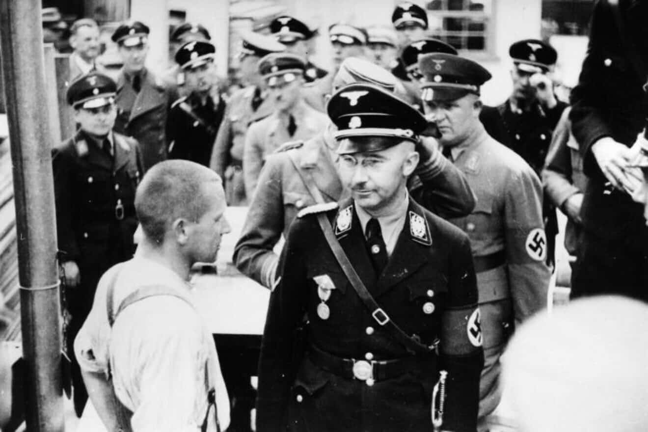 Reichsführer-SS Heinrich Himmler inspecting the Dachau concentration camp on May 8, 1936. Credit: Bundesarchiv Bild via Wikimedia Commons.