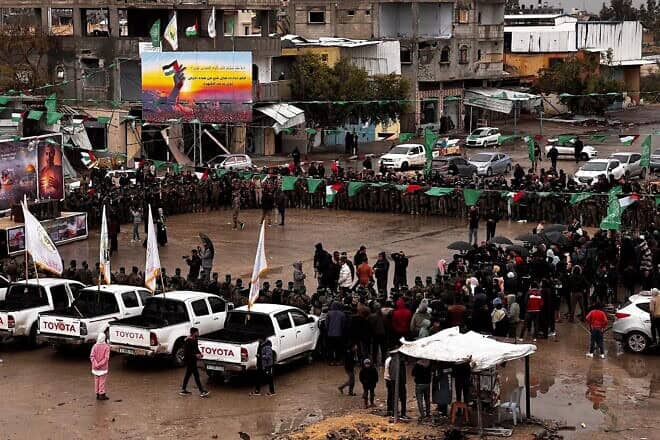 Palestinian terrorists prepare to release Israeli hostages in southern Gaza's Rafah, Feb. 22, 2025. Photo by Saeed Mohammed/Flash90.