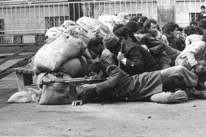 Armed rebels during the Islamic Revolution in Iran in 1979. Credit: Public Domain via Wikimedia Commons.