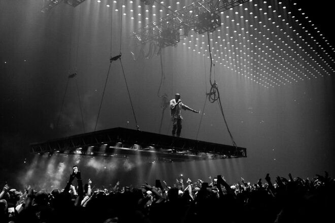 Rapper Kanye West, now known as Ye, performing at the Saint Pablo Tour in 2016. Credit: Kenny Sun/Flickr via Wikimedia Commons.