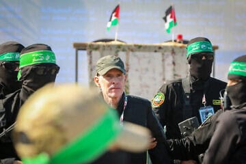 The Hamas military unit, Al-Qassam Brigades, hands over Israeli hostage Keith Siegel to the Red Cross as part of the ceasefire agreement between Israel and Hamas, in Gaza City, Feb. 1, 2025. Photo by Ali Hassan/Flash90.