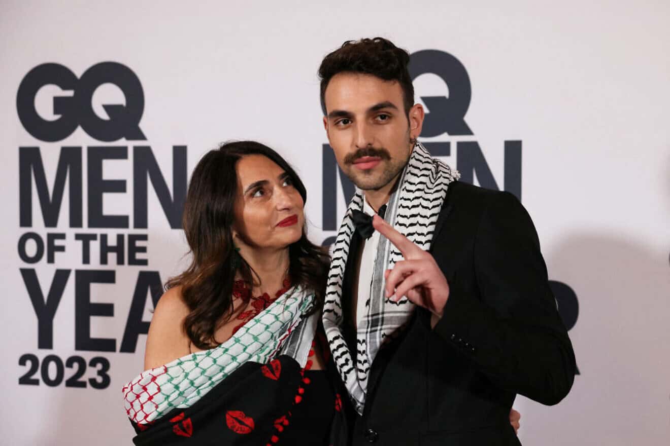 Palestinian singer Marwan Abdelhamid (right) aka Saint Levant poses during a photocall before the unveiling ceremony for the GQ Men of the Year 2023 in Paris on Nov. 30, 2023. Photo by Alain Jocard/AFP via Getty Images.