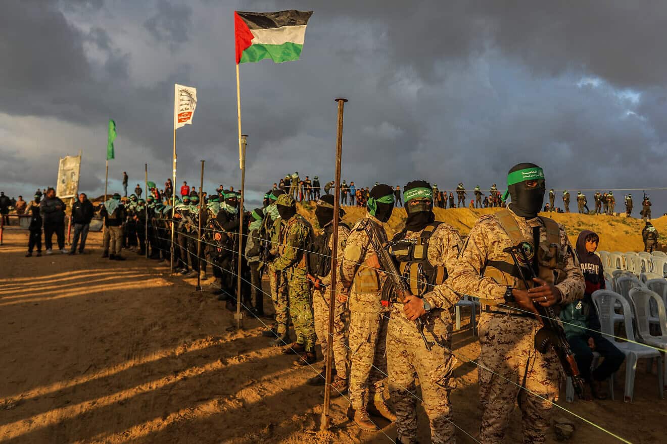 Al-Qassam Brigades terrorists and ordinary Gazans waiting for the handover of the bodies of four Israeli hostages to the Red Cross in Khan Yunis, Feb. 20, 2025. Photo by Abed Rahim Khatib/Flash90.