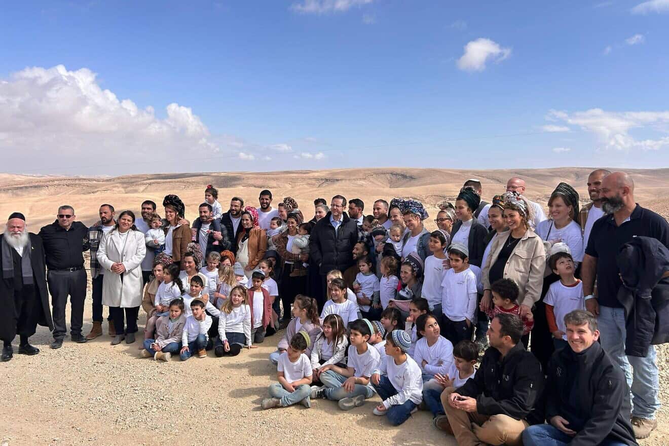 Israeli President Isaac Herzog (center) attends a tree planting ceremony at Mitzpe Yonaton, near Arad, on Feb. 13, 2025. Credit: Courtesy.