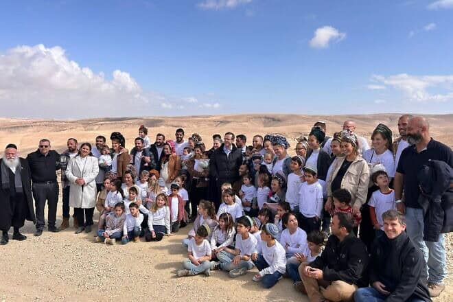 Israeli President Isaac Herzog (center) attends a tree planting ceremony at Mitzpe Yonaton, near Arad, on Feb. 13, 2025. Credit: Courtesy.