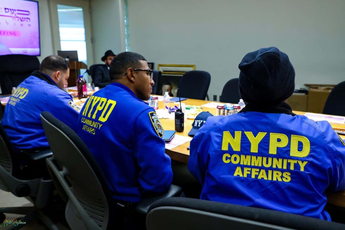 New York City Police Department officials from the 71st and 77th precincts, and Brooklyn South, meet with representatives of the Chabad-Lubavitch movement prior to the International Conference of Chabad-Lubavitch Women (Kinus Hashluchos) to take place from Feb. 19-23, 2025. Photo by Itzik Roitman.