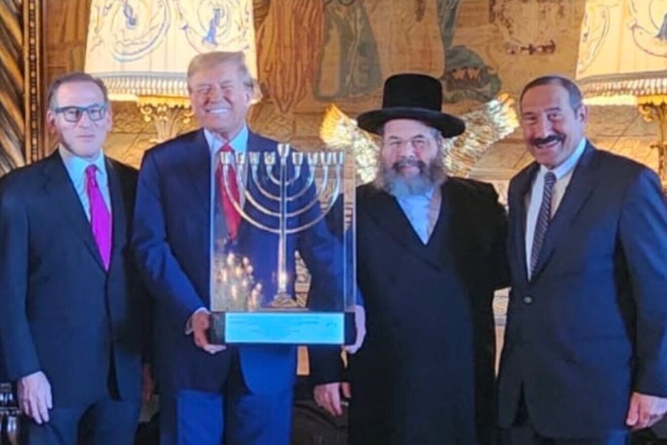 Presenting Donald Trump with a menorah are (from left) Israel Heritage Foundation President Dr. Stephen Soloway, executive director Rabbi David Katz and executive vice president Dr. Joseph Frager, in February 2024. Credit: Courtesy.