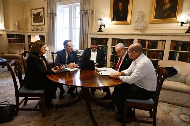 Israeli Prime Minister Benjamin Netanyahu prepares for his meeting with U.S. President Donald Trump surrounded by his advisers, including American-born Caroline Glick and Ron Dermer (center), on Feb. 4 2025. Photo by Avi Ohayon/GPO.