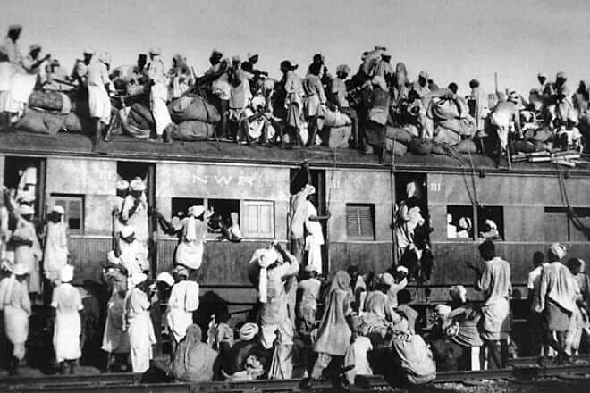 An overcrowded train transferring refugees during the partition of India, 1947, considered to be one of the largest migrations in human history. Credit: Wikimedia Commons.