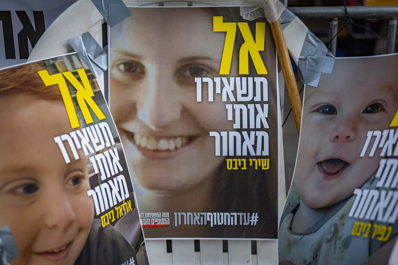 Pictures of Shiri Bibas and her children, Ariel and Kfir, hang outside the prime minister's residence in Jerusalem, Feb. 19, 2025. Photo by Chaim Goldberg/Flash90.