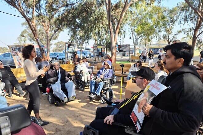 “Accessible Pathways” tour participants gather to see sites associated with the Hamas-led Oct. 7 terrorist attacks in southern Israel, Jan. 30, 2023. Credit: Courtesy of Yad Sarah.