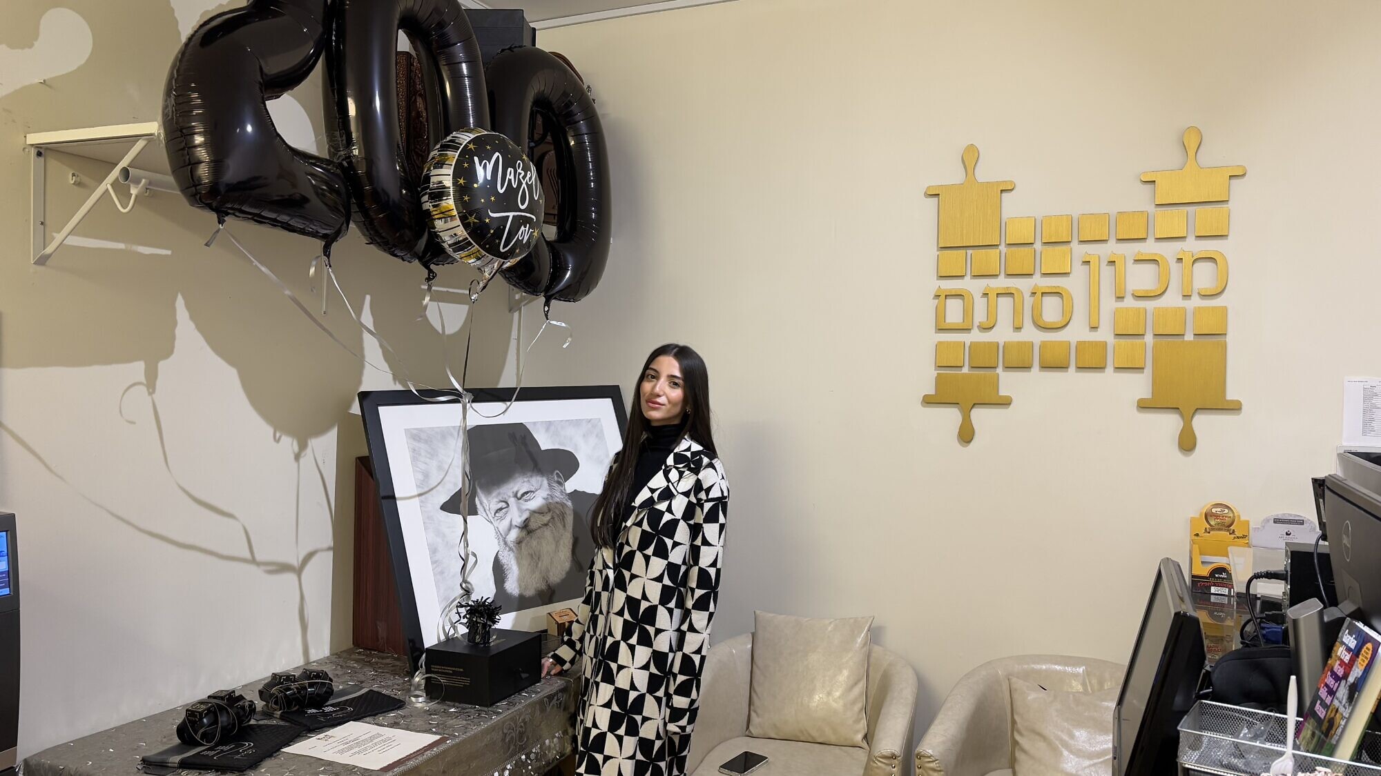 Mary Jarada, 23, founder of the charity campaign Tefillin on Us, at Machon Stam in the Crown Heights neighborhood of Brooklyn, N.Y., from which she had just purchased her 200th pair of tefillin to donate, Jan. 8, 2025. Photo by Vita Fellig.