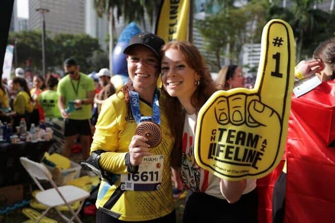 Tzipora Grodko (left) celebrates her completion of the Miami Marathon with her friend Esti Caplan, who flew in to cheer her on. Credit: Courtesy.