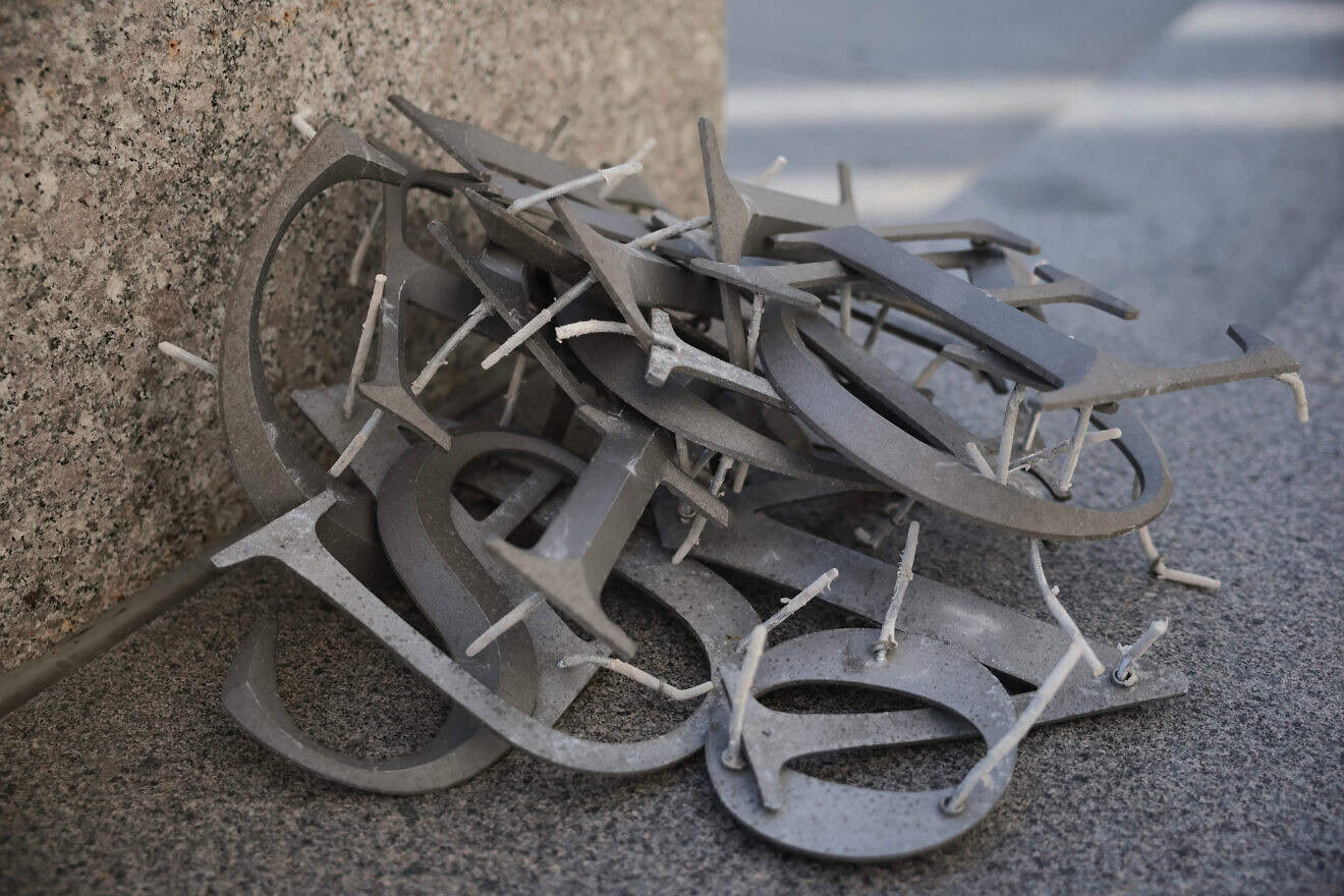 A pile of building letters after a worker removed the U.S. Agency for International Development (USAID) sign on its headquarters in Washington, DC., Feb. 7, 2025. Photo by Kayla Bartkowski/Getty Images.