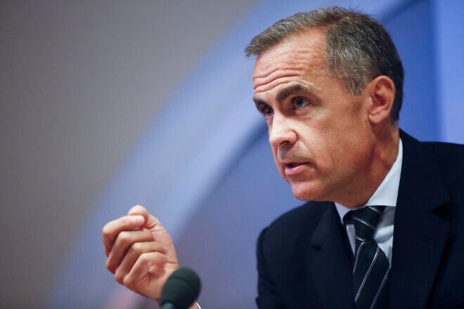 Mark Carney, governor of the Bank of England, gestures during the bank's quarterly inflation report news conference at the Bank of England in London, U.K., Nov. 13, 2013. Credit: Simon Dawson/Bloomberg/Bank of England via Creative Commons.