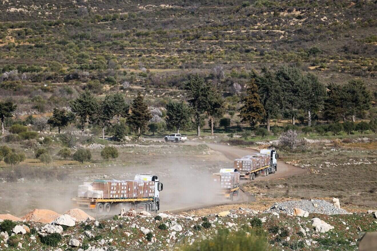 Israeli trucks delivering aid to Druze communities in southern Syria in a photo published on March 13, 2025. Photo by Sivan Shachor, GPO.
