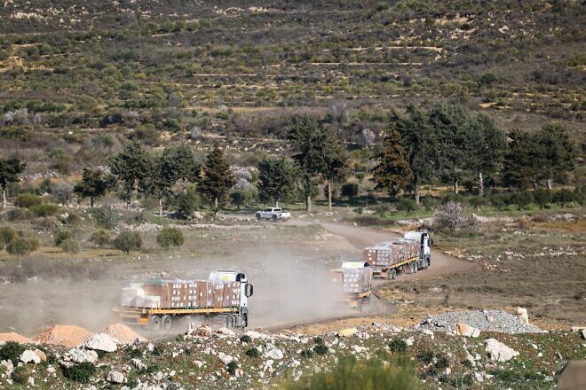 Israeli trucks delivering aid to Druze communities in southern Syria in a photo published on March 13, 2025. Photo by Sivan Shachor, GPO.