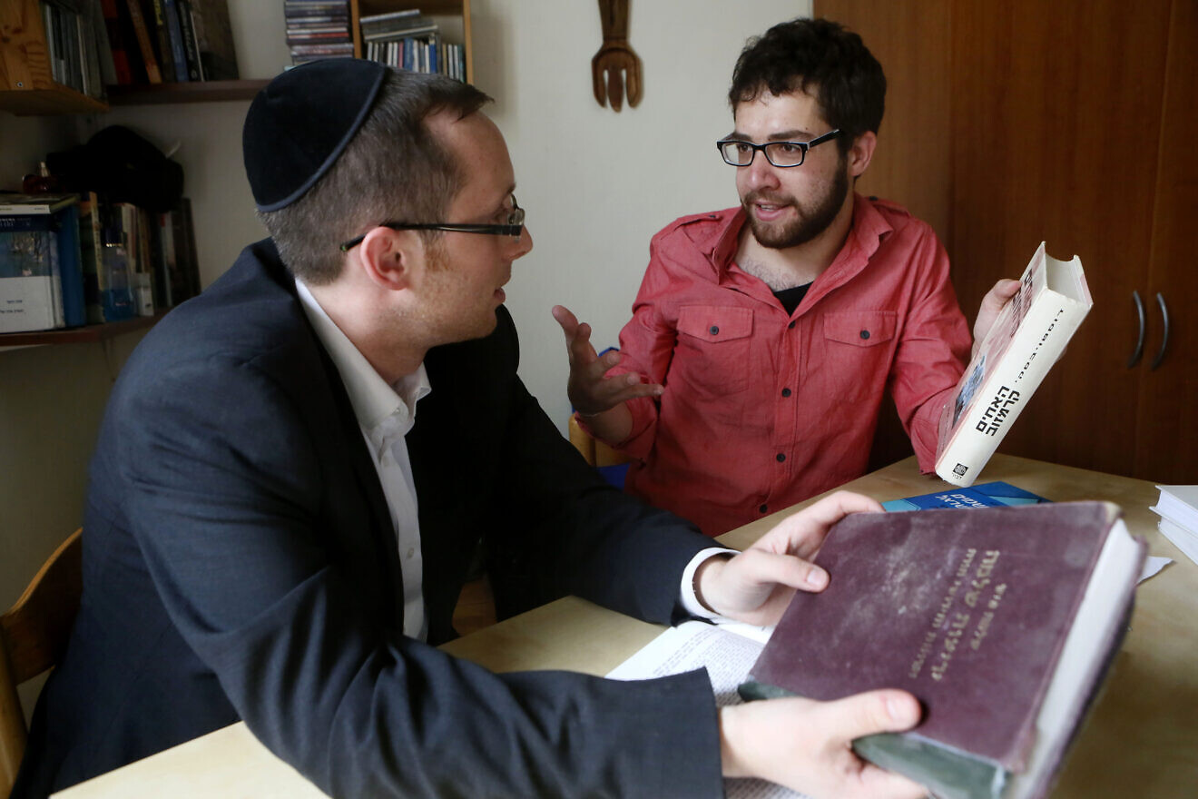 Yehuda Aronsson, who is Orthodox, and Ran Milon, who is secular, study Torah and subjects like literature and math as part of a project having secular and Orthodox people learn from each other, March 12, 2013. Credit: Miriam Alster/Flash90.