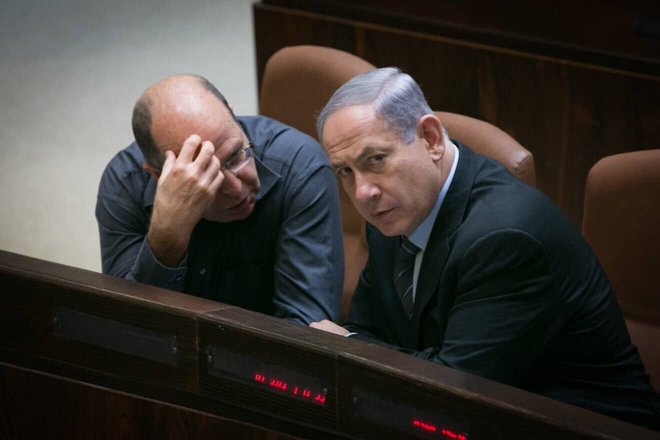 Israeli Prime Minister Benjamin Netanyahu speaks with Defense Minister Moshe Ya'alon in the plenary hall of the Knesset, the Israeli parliament in Jerusalem, May 11, 2015. Photo by Miriam Alster/Flash90.