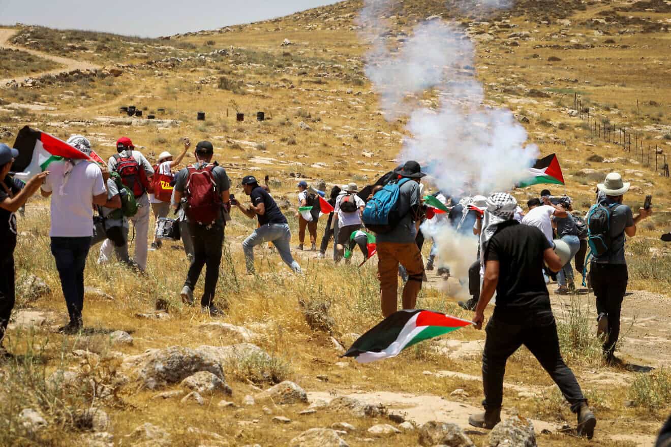 Palestinians and left-wing activists clash with Israeli forces during a protest in Masafer Yatta, on June 10, 2022. Photo By Wisam Hashlamoun/Flash90.