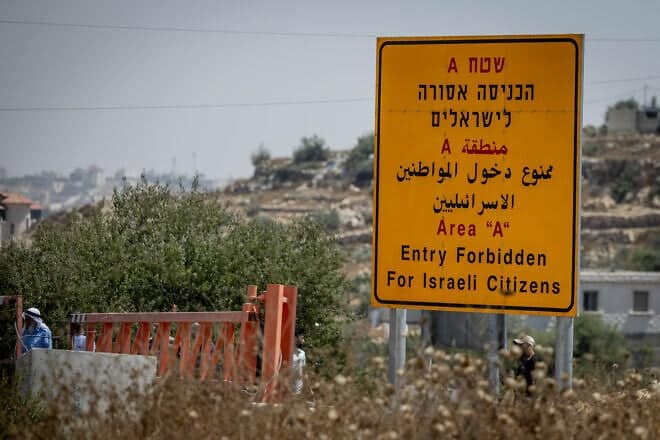 A sign on Route 60 near Hebron in Judea warning Israelis against entering Area A, which is under control of the Palestinian Authority, Aug. 21, 2023. Photo by Chaim Goldberg/Flash90.