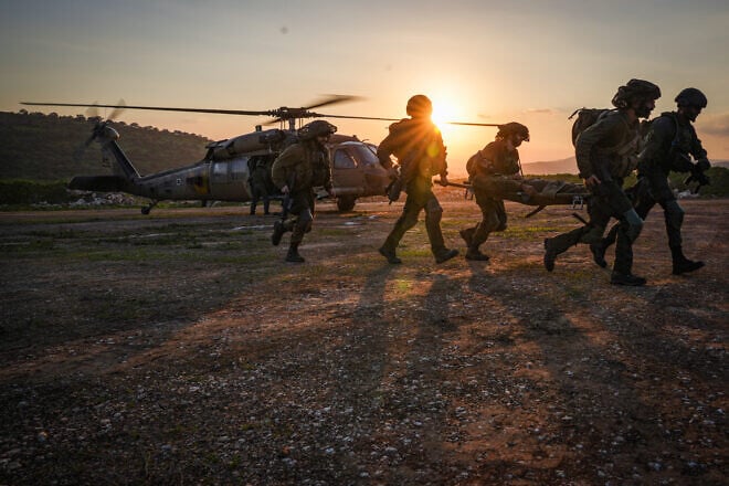 Israeli soldiers drill the evacuation of wounded comrades via helicopter in the Golan Heights, Feb. 7, 2024. Photo by Ayal Margolin/Flash90.