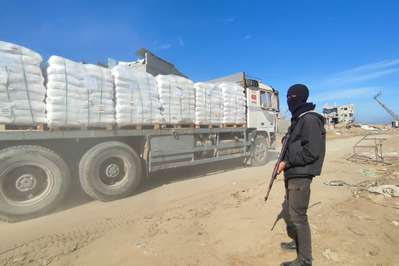 Palestinian trucks loaded with aid flow into Gaza through the Kerem Shalom crossing as part of the ceasefire agreement in the Gaza Strip, east of the city of Rafah in the southern Gaza Strip. Photo by Abed Rahim Khatib.