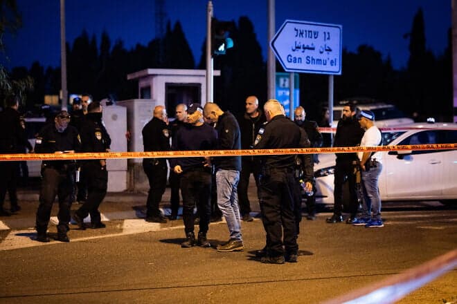 Police at the scene of a terrorist car-ramming attack at the Karkur Junction, Feb. 27, 2025. Photo by Itay Cohen/Flash90.