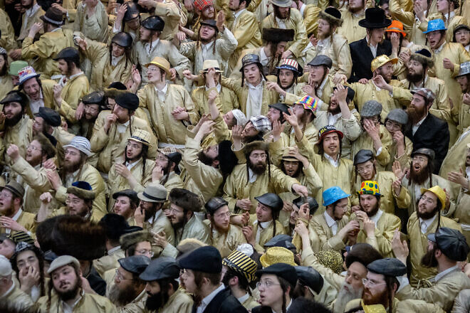 Members of the Toldos Aharon Hasidic dynasty celebrate the Jewish holiday of Purim in the ultra-orthodox Mea Shearim neighborhood in Jerusalem on March 16, 2025. Photo by Chaim Goldberg/Flash90.