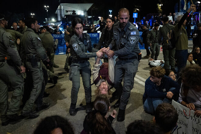 Police clash with demonstrators during a protest against the Israeli government outside the Knesset on March 25, 2025. Photo by Yonatan Sindel/Flash90.