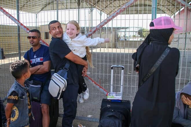 Foreign citizens wait at the Rafah crossing to be allowed to travel on Oct. 21, 2023 in Rafah, Gaza. Photo by Ahmad Hasaballah/Getty Images.