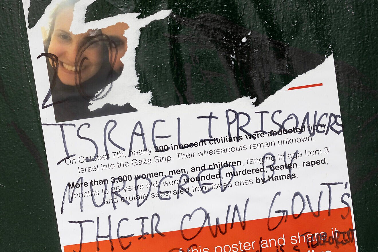 Posters distributed around New York University of people kidnapped by Hamas on Oct. 7 are vandalized and covered with pro-Palestinian graffiti on Oct. 25, 2023. Photo by Andrew Lichtenstein/Corbis via Getty Images.