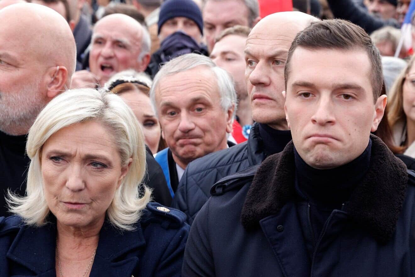 French far-right party National Rally member of Parliament Marine Le Pen and the president of French far-right party Rassemblement National Rally Jordan Bardella march during a demonstration against antisemitism in Paris, on Nov. 12, 2023. Photo by Geoffroy Van der Hasselt/AFP via Getty Images.
