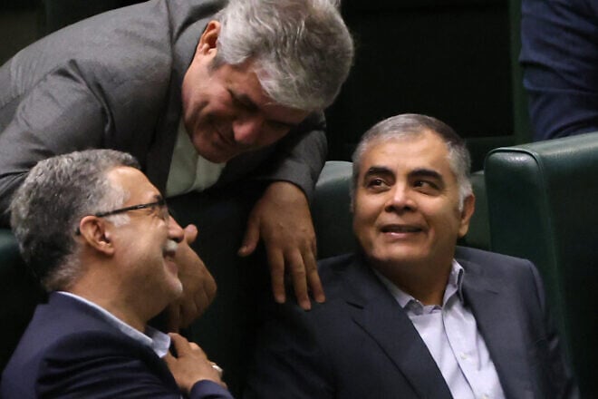 Mohsen Paknejad (right), Iran's nominee for the oil ministry, attends a parliament session in the capital Tehran, Aug. 17, 2024. Photo by Atta Kenare/AFP via Getty Images.