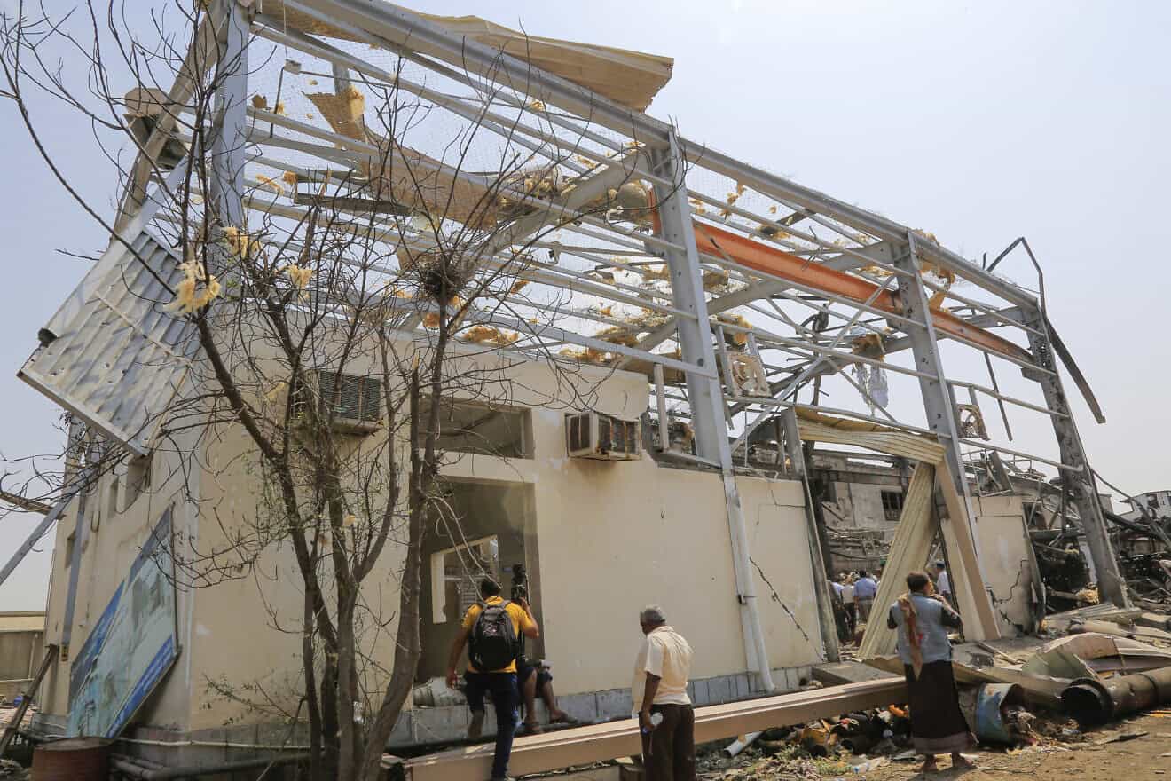 People check the destruction at a power station at the port in Yemen's rebel-held Hodeida city, a day after it was targeted in Israeli strikes, on Sept. 30, 2024. Photo by -/AFP via Getty Images.