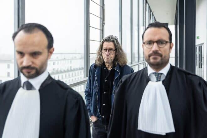 Belgian writer Herman Brusselmans and his attorneys at the Gent Correctional Court, Nov. 5, 2024. Photo by James Arthur Gekiere/BELGA MAG/AFP via Getty Images.